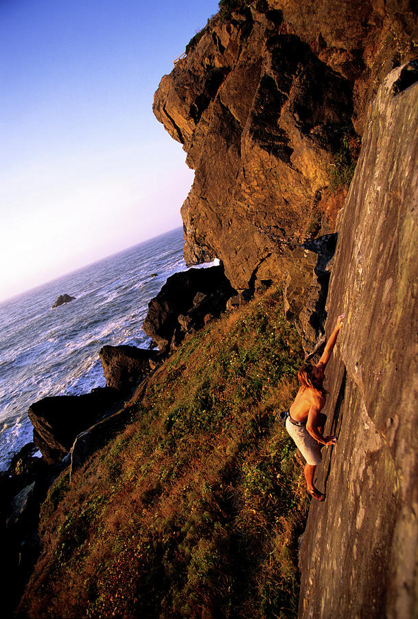 A Man Is Bouldering Near The Ocean Photograph by Bennett Barthelemy A Man Is Bouldering Near The Ocean Photograph by Bennett Barthelemy