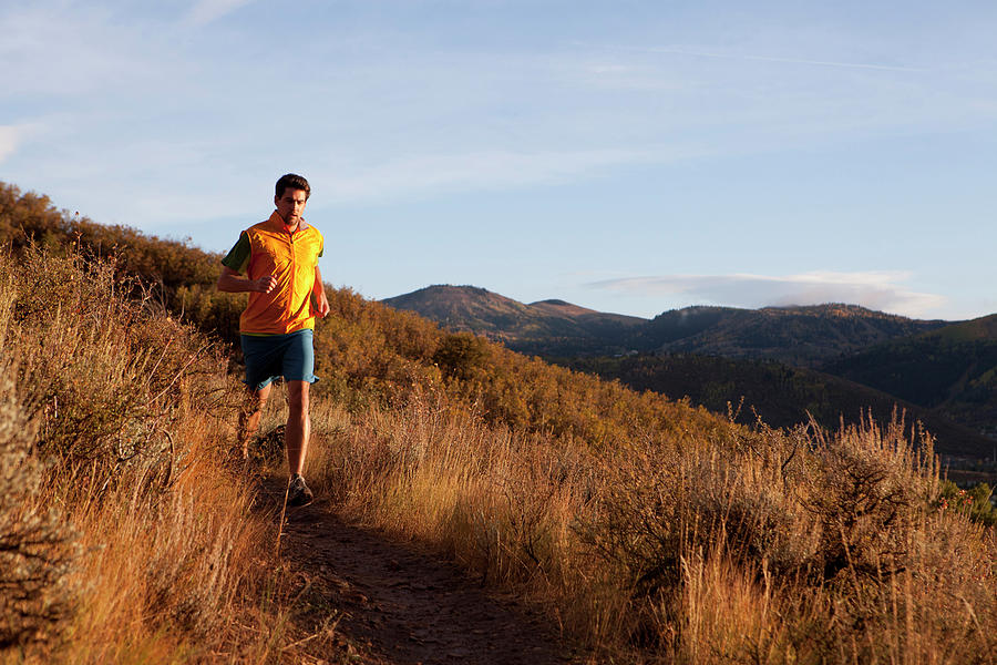 A Man Out For An Early Evening Run Photograph by Mike Schirf