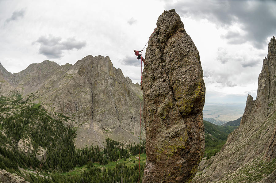 A Man Rappelling Off Of Rock Spire Photograph by Kennan Harvey A Man Rappelling Off Of Rock Spire Photograph by Kennan Harvey