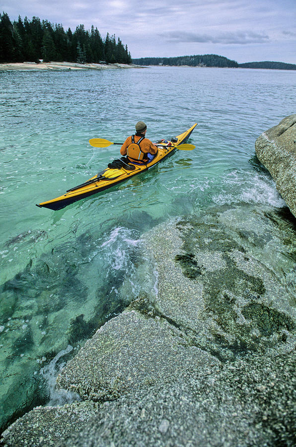 Color Image Photograph - A Man Sea Kayaks In Penobscot Bay by Abrahm Lustgarten