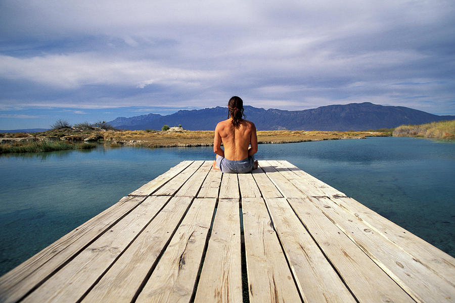 A Man Sitting At The End Of A Dock Photograph By Corey Rich Fine Art America