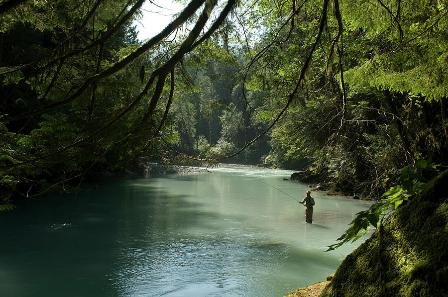 Adult Photograph - A Man Stands In A River Wearing Waders by Alain Denis Adult Photograph - A Man Stands In A River Wearing Waders by Alain Denis