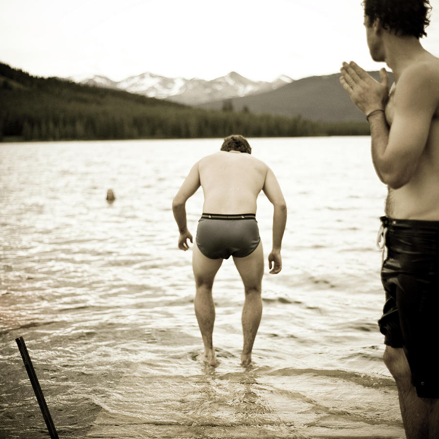 A Man Stands On A Dock In His Underwear by Kari Medig