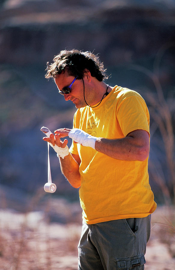 A Man Taping His Hands Before A Climb Photograph By Corey Rich Fine Art America