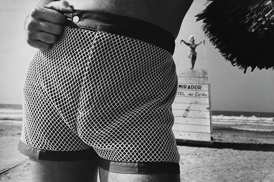 A Man Wearing A Swimsuit Photograph by Peter Levy