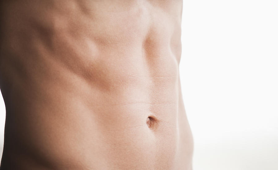 A mans shirtless abdomen Photograph by Daniel Grill