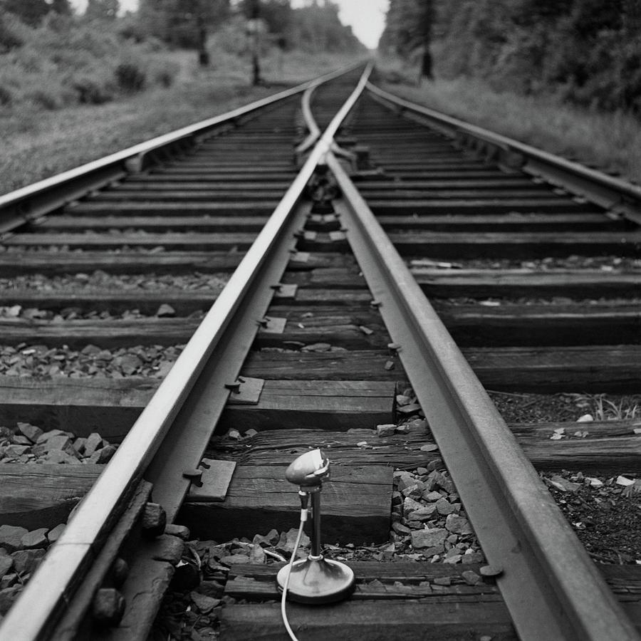 A Microphone Placed In Between Railroad Tracks Photograph by Richard Rutledge