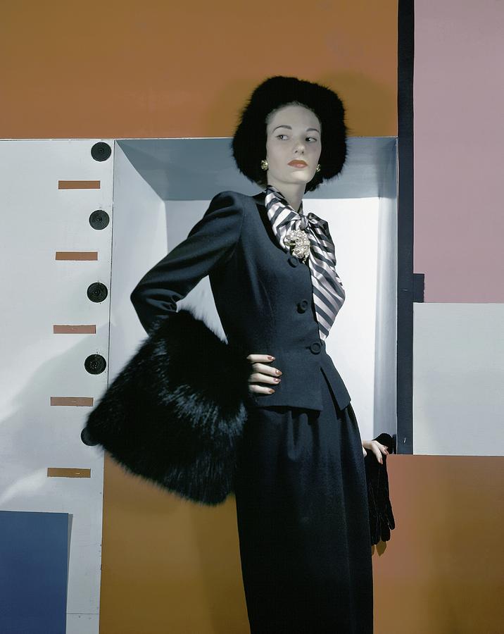 A Model Holding A Muff Photograph by Horst P. Horst
