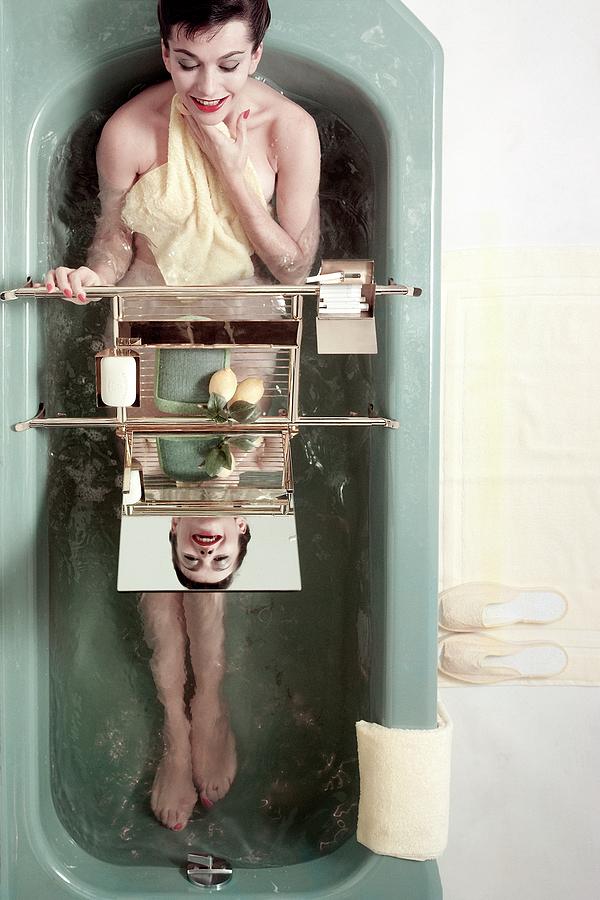 A Model In A Bathtub Photograph by Herbert Matter