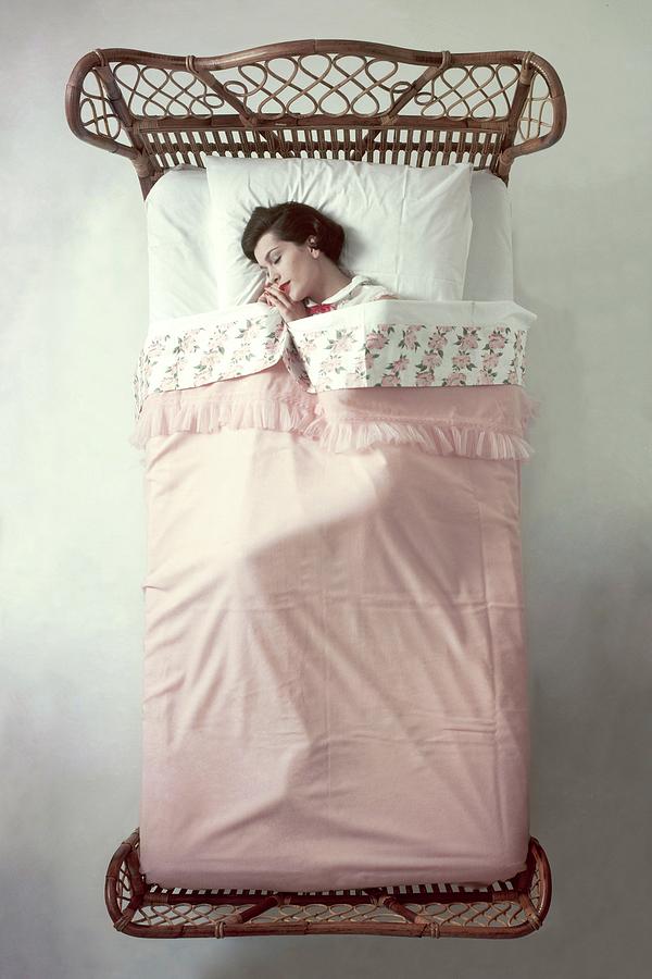 A Model In A Bed Photograph by Herbert Matter