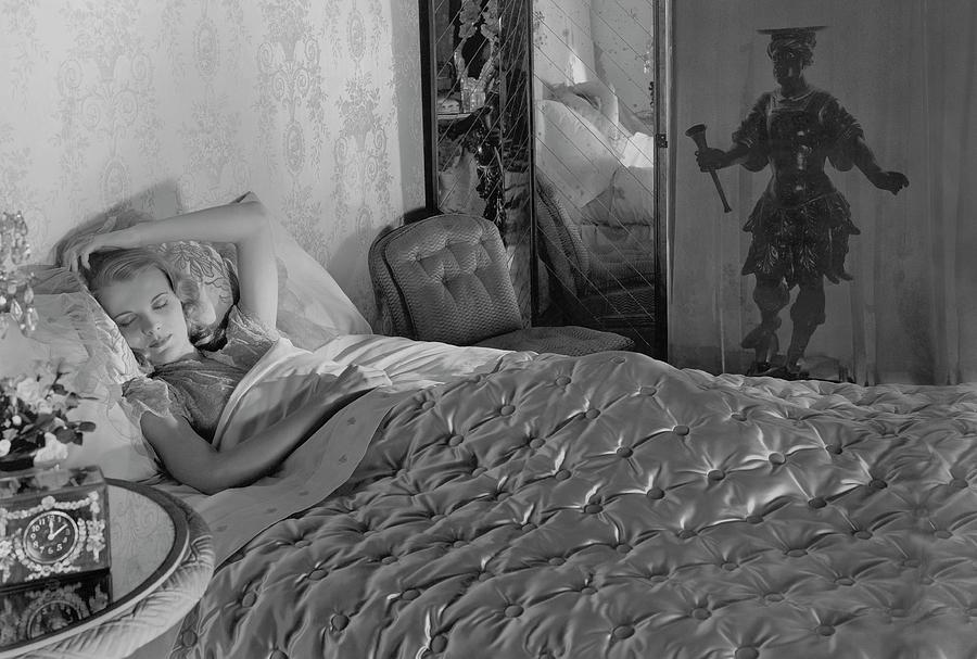 A Model In A Bed With Designer Bedding Photograph by Horst P. Horst