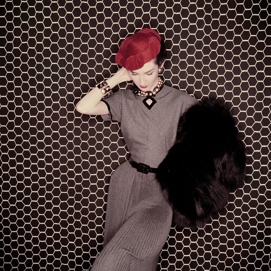 A Model In A Grey Dress And Red Hat Photograph by Clifford Coffin