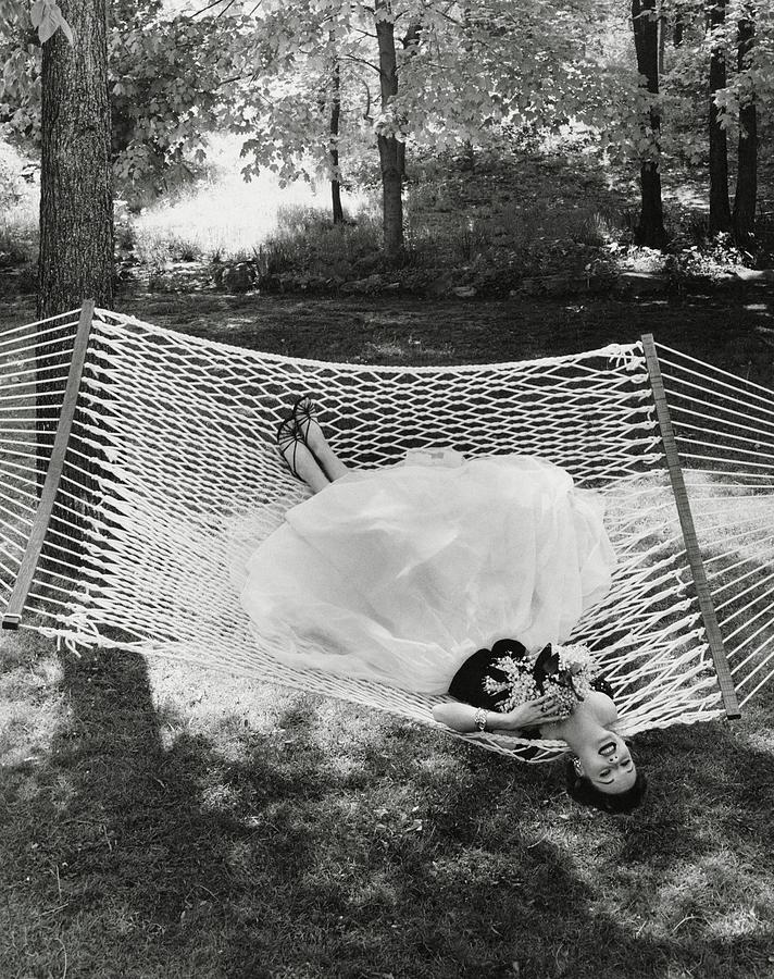 A Model Lying On A Hammock Photograph by Gene Moore