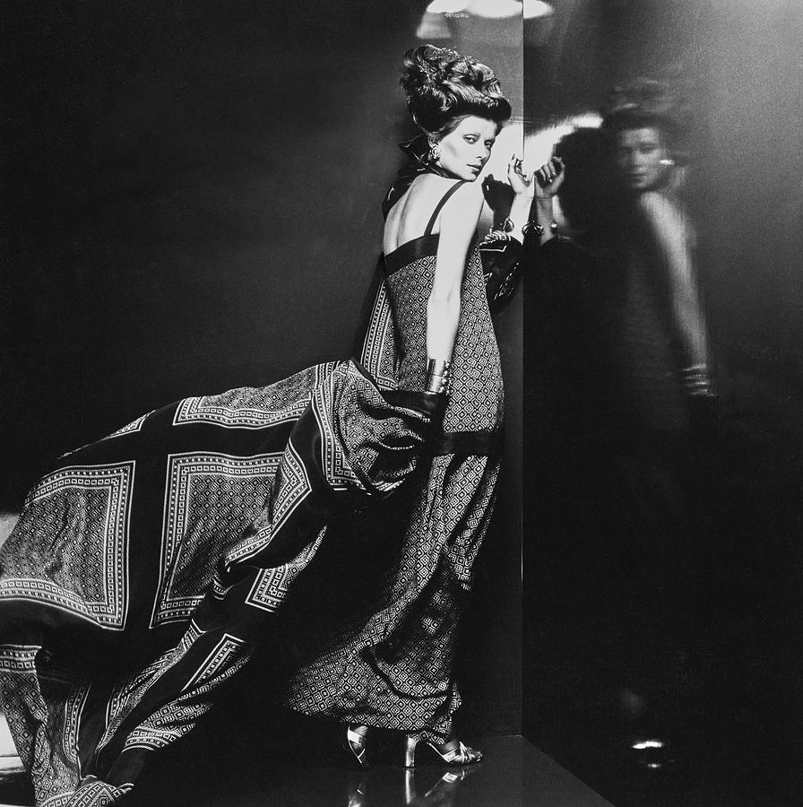 A Model Poses In A Coat By Patou Photograph by Chris von Wangenheim