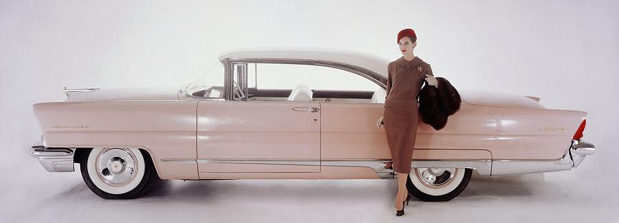 A Model Posing In Front Of A Vintage Car Photograph by Karen Radkai