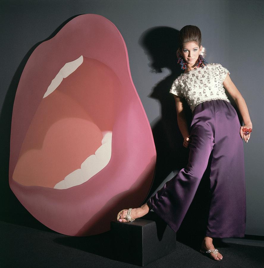 A Model Posing Next To A Large Painting Photograph by Horst P. Horst