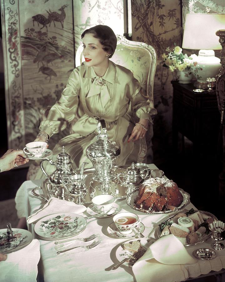 A Model Sitting In A Lavish Dining Room Photograph by Horst P. Horst A Model Sitting In A Lavish Dining Room Photograph by Horst P. Horst