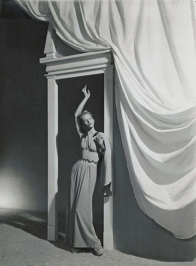 A Model Standing In A Door Frame Photograph by Horst P. Horst