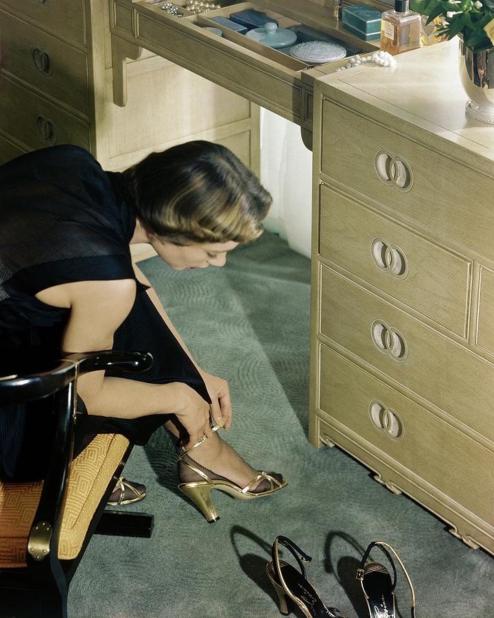 A Model Trying On A Pair Of High Heels Photograph by Herbert Matter