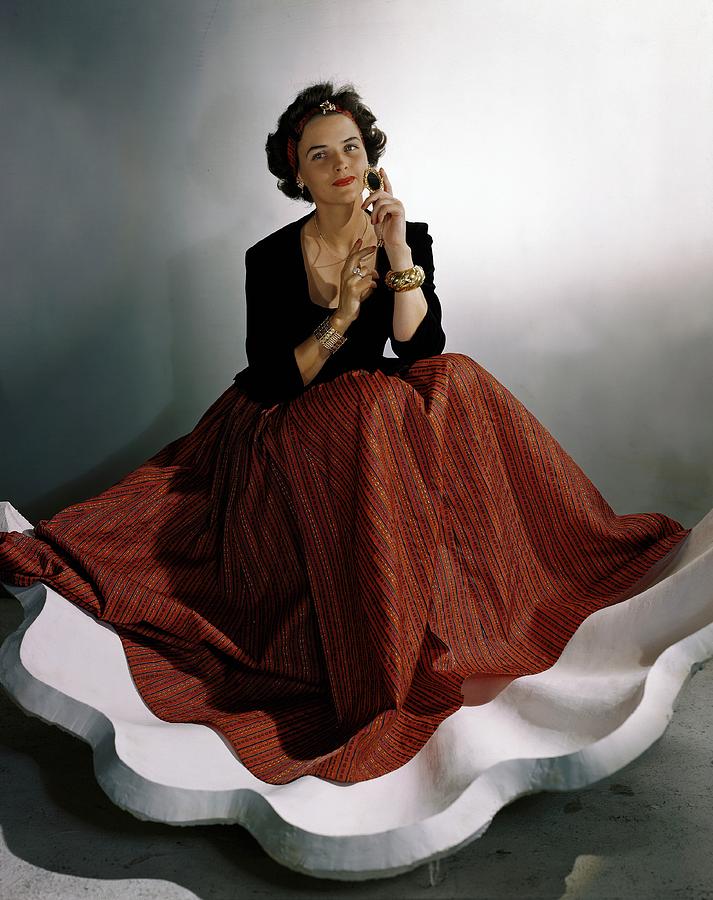 A Model Wearing A Billowing Red Skirt Photograph by Horst P. Horst