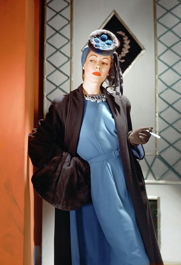 A Model Wearing A Blue Dress Photograph by Horst P. Horst