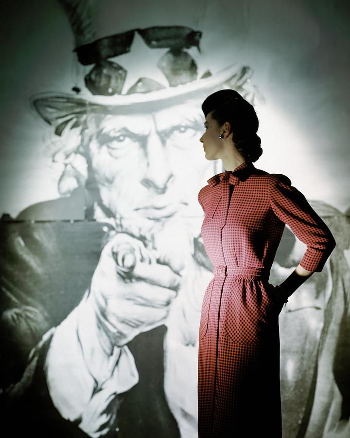 A Model Wearing A Checked Dress Photograph by John Rawlings