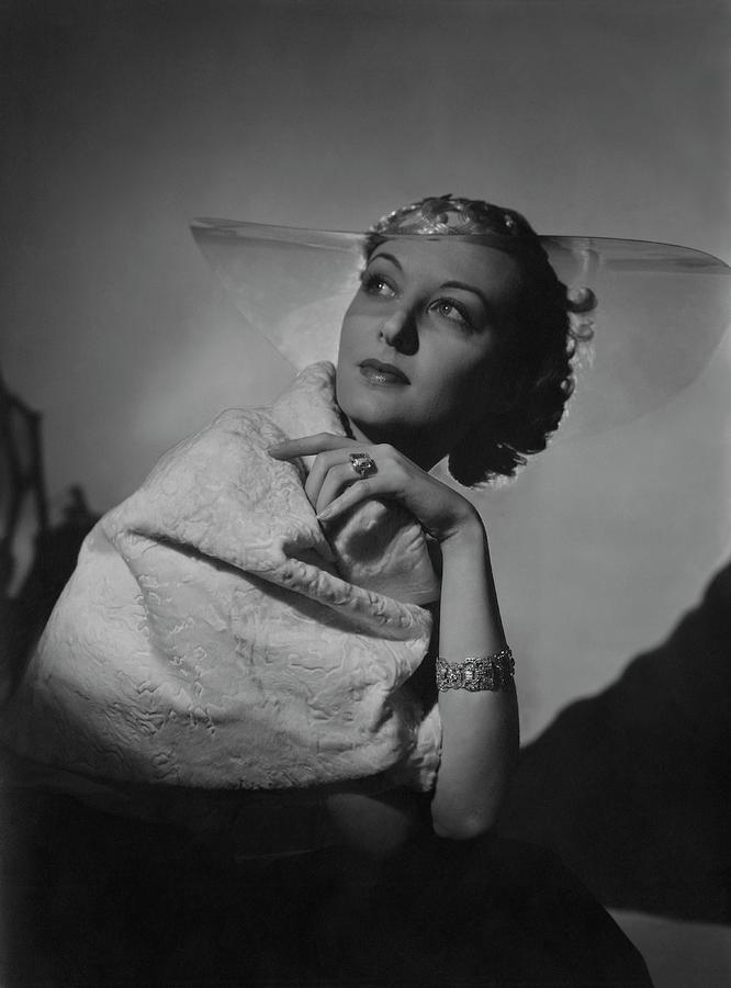 A Model Wearing A Coat And Glass Hat Photograph by Horst P. Horst