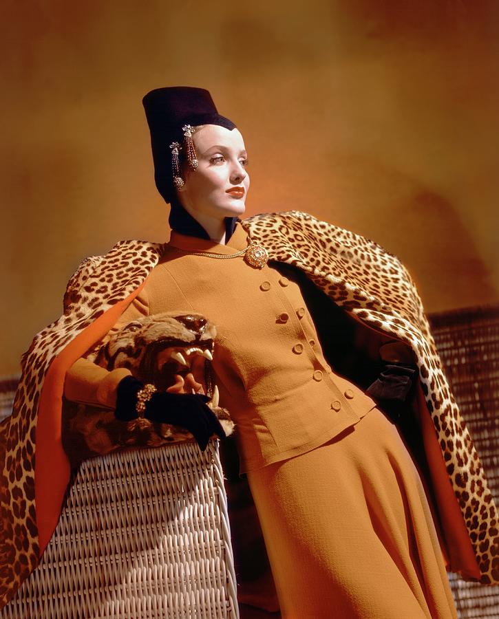 A Model Wearing A Leopard Print Cape And Orange Photograph by Horst P. Horst