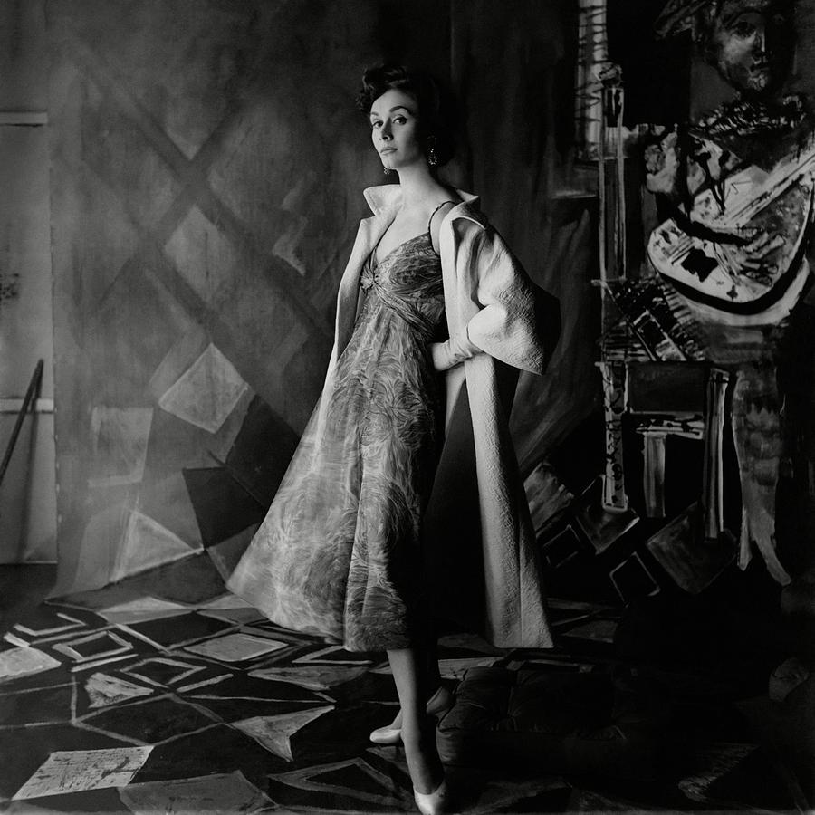 A Model Wearing A Printed Dress And Jacket Photograph by Henry Clarke