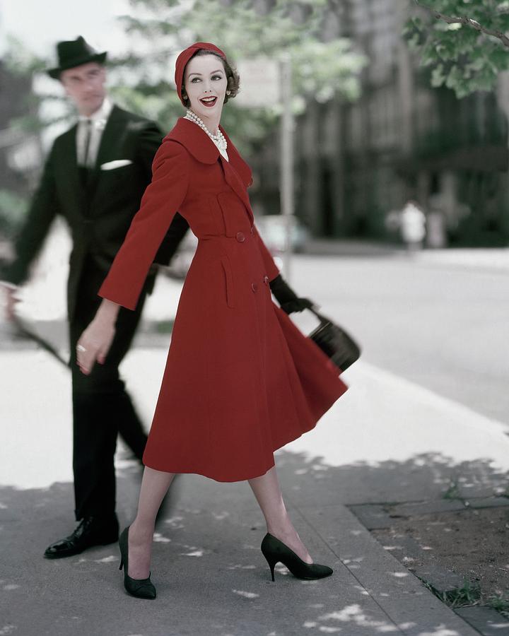 A Model Wearing A Red Coat Photograph by Karen Radkai