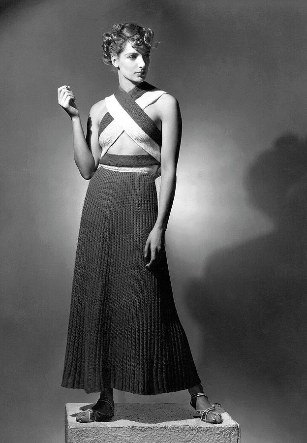 A Model Wearing A Ribbed Knit Dress Photograph by Horst P. Horst