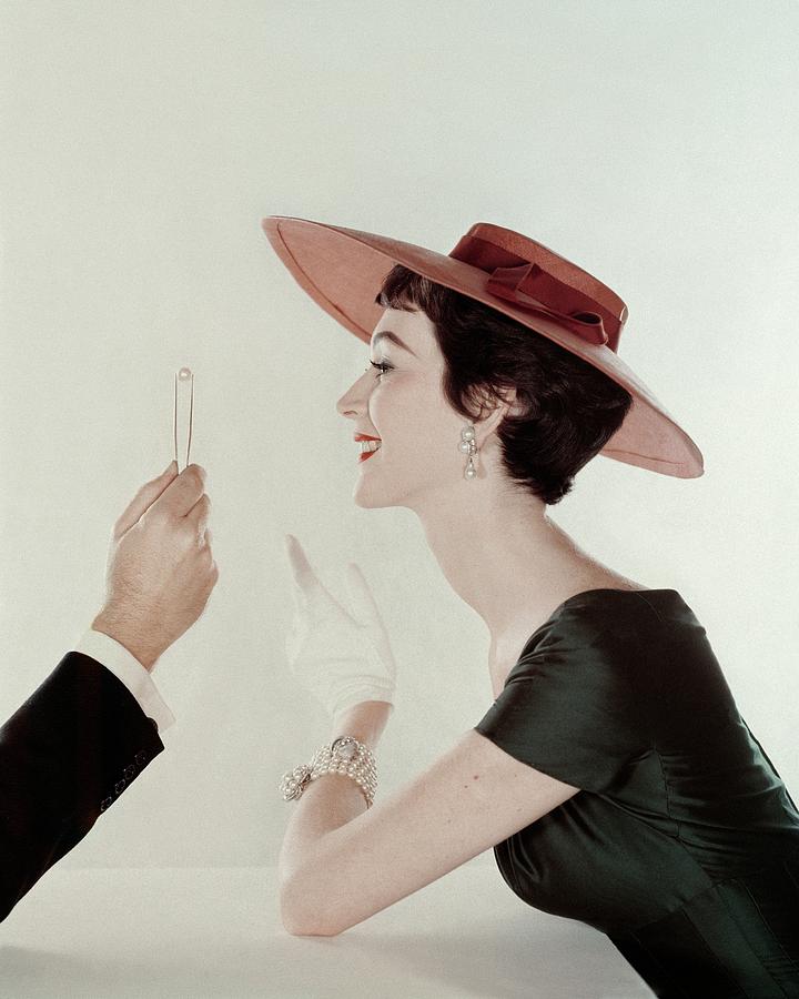 A Model Wearing A Sun Hat And Dress Photograph by John Rawlings A Model Wearing A Sun Hat And Dress Photograph by John Rawlings