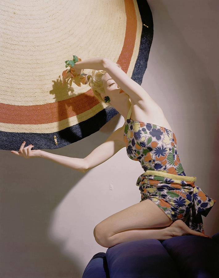 A Model Wearing A Swimsuit And Holding An Photograph by Horst P. Horst A Model Wearing A Swimsuit And Holding An Photograph by Horst P. Horst