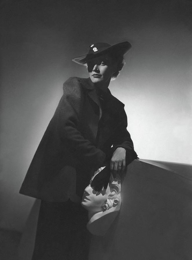 A Model Wearing A Wool Jacket And Hat Photograph by Horst P. Horst