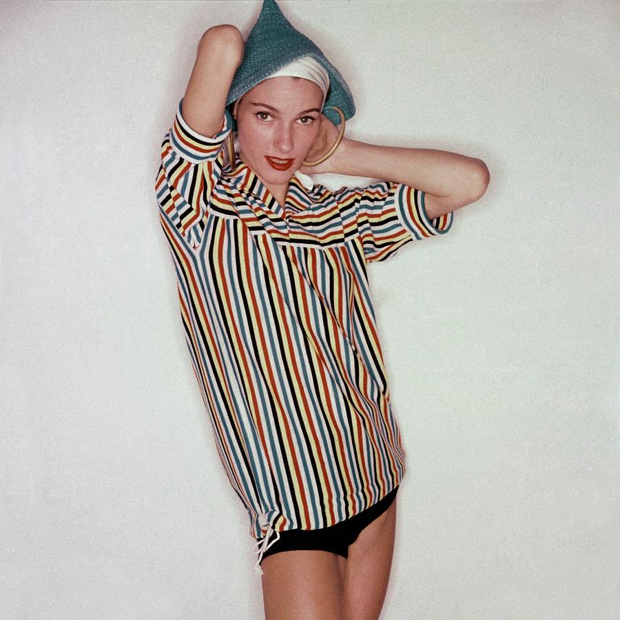 A Model Wearing Swimwear And A Striped Shirt Photograph by Clifford Coffin