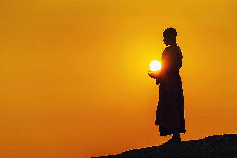 A monk standing meditation. Photograph by Sangkhom Simma