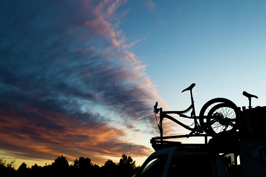 Sunset Photograph - A Mountain Bike On The Roof Of A Truck by Dan Barham
