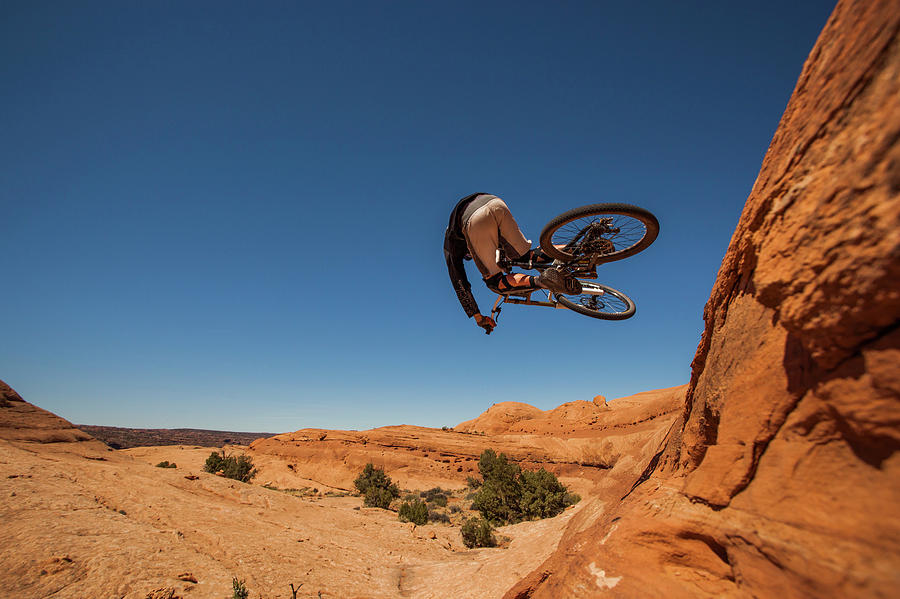 A Mountain Biker Jumping Photograph by Whit Richardson - Fine Art America