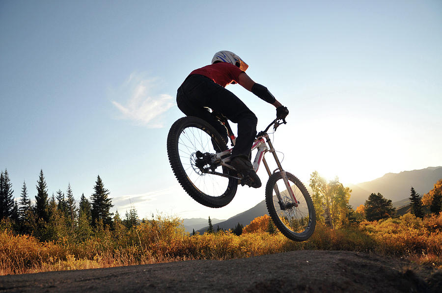A Mountain Biker Splashed In Fall Sun Photograph by Bud Force - Fine ...