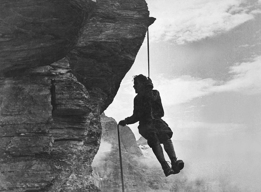 A Mountain Climber Rappelling Photograph by Underwood Archives