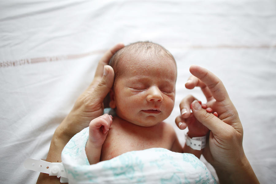 A newborn at maternity ward Photograph by Catherine Delahaye