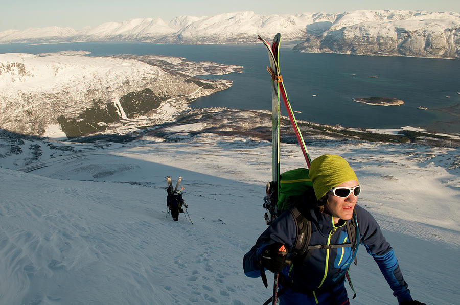 20s Photograph - A Norwegian Skier Climbs Above Lyngen by Kari Medig