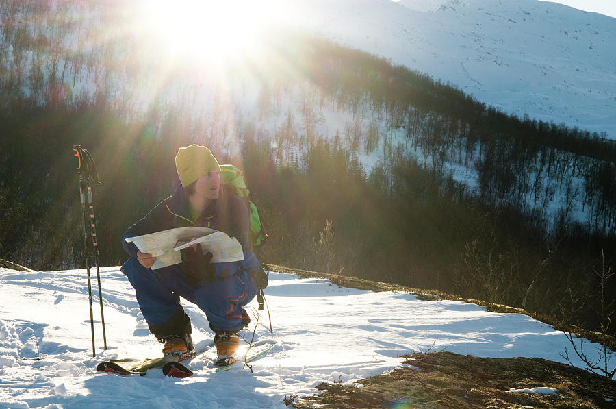 20s Photograph - A Norwegian Skier Examines A Map by Kari Medig 20s Photograph - A Norwegian Skier Examines A Map by Kari Medig