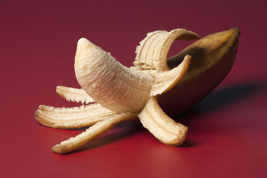 A peeled banana suggestive of an erect penis Photograph by Larry Washburn