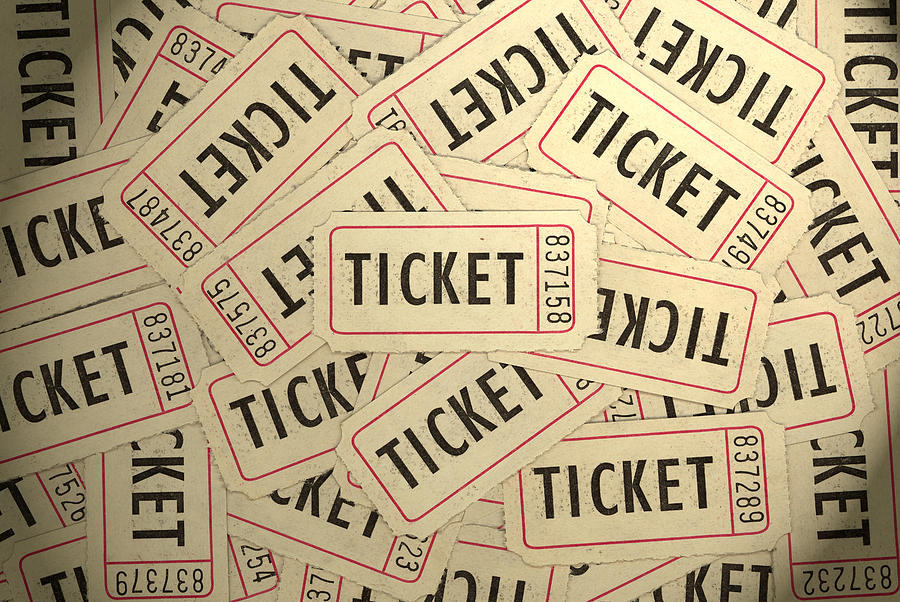 A pile of several white, black and red ticket stubs Photograph by Belterz