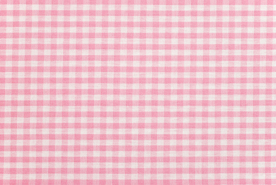 A pink gingham pattern fabric background Photograph by Esemelwe