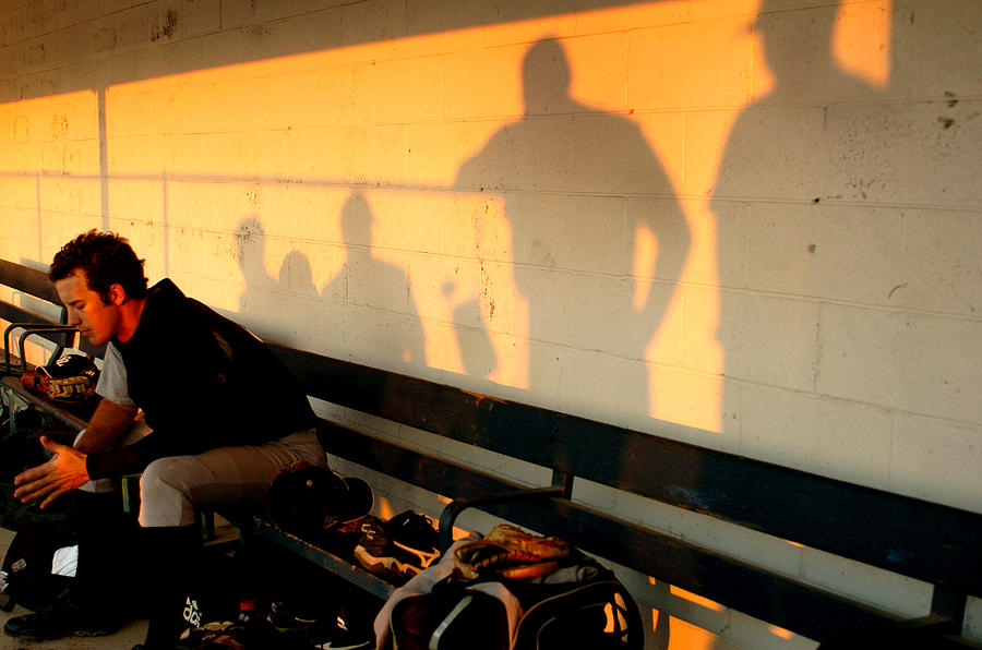 Baseball Photograph - A Pitcher Sits In The Dugout At Sunset by Suzy Allman