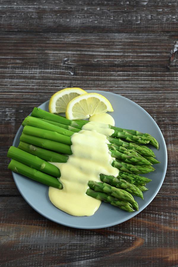 A Plate Of Asparagus Topped With Photograph by Sbossert