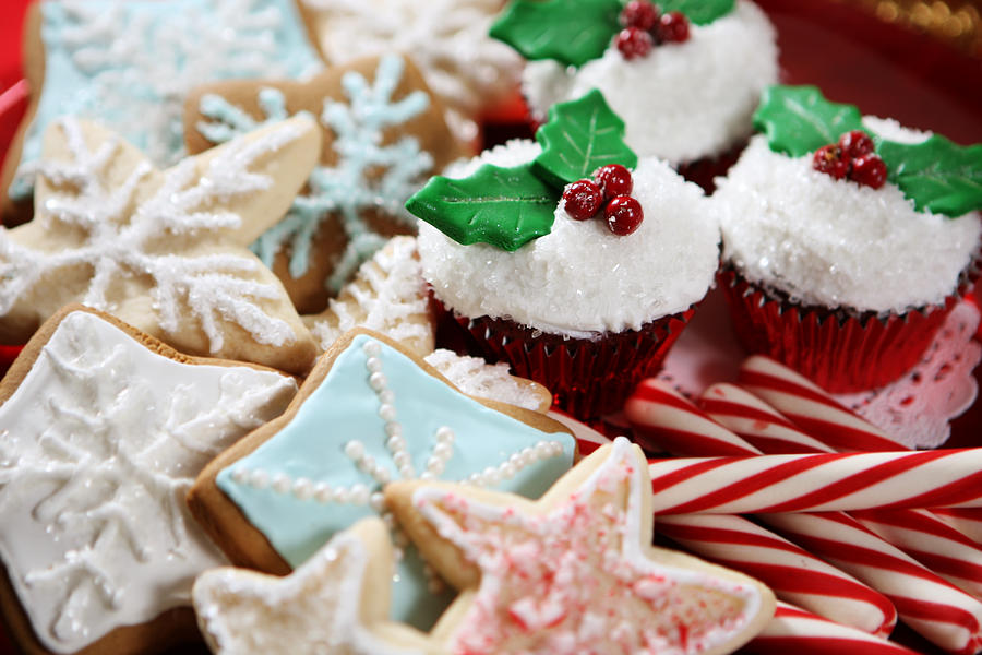 A plate of Christmas cookies, cupcakes and candy canes Photograph by Kirin_photo