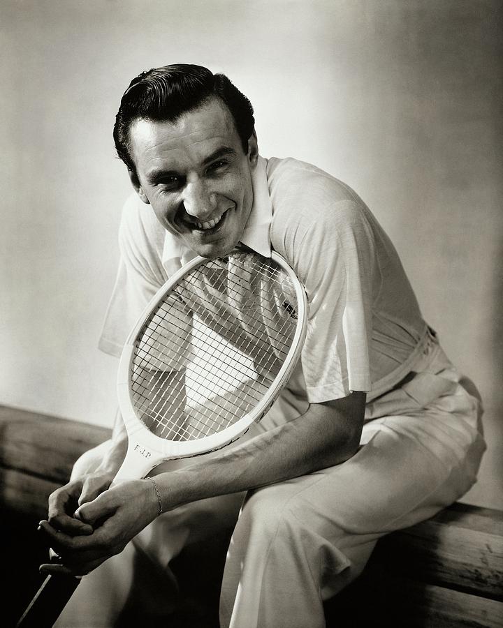 A Portrait Of Fred Perry With A Tennis Racket Photograph by Anton Bruehl